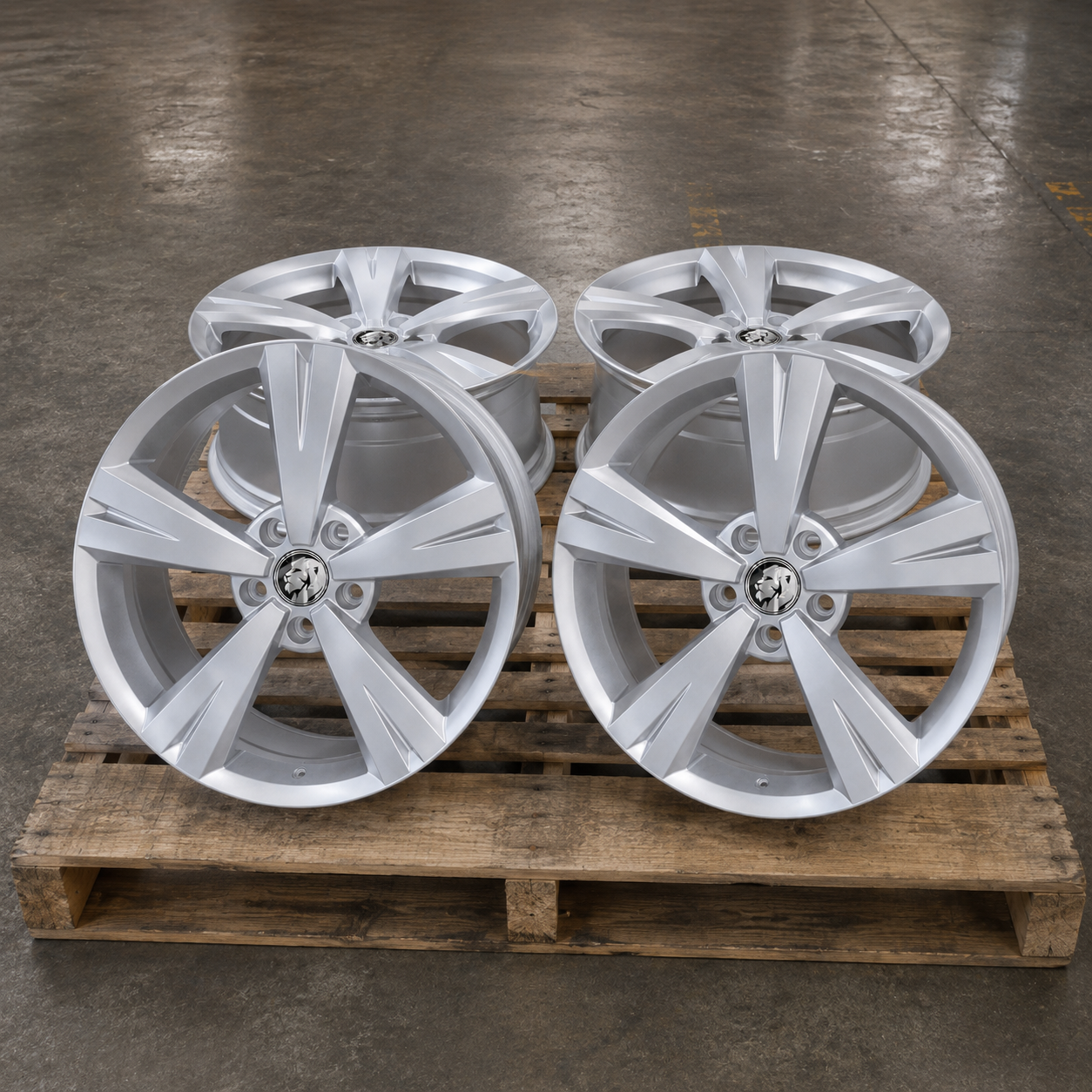 Set of 19x8 shadow chrome wheel rims on pallet
