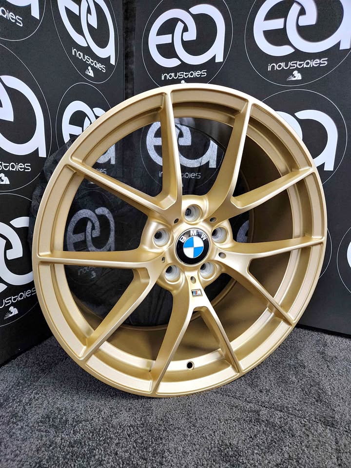 BMW M3 Competition style gold wheel rim showroom view